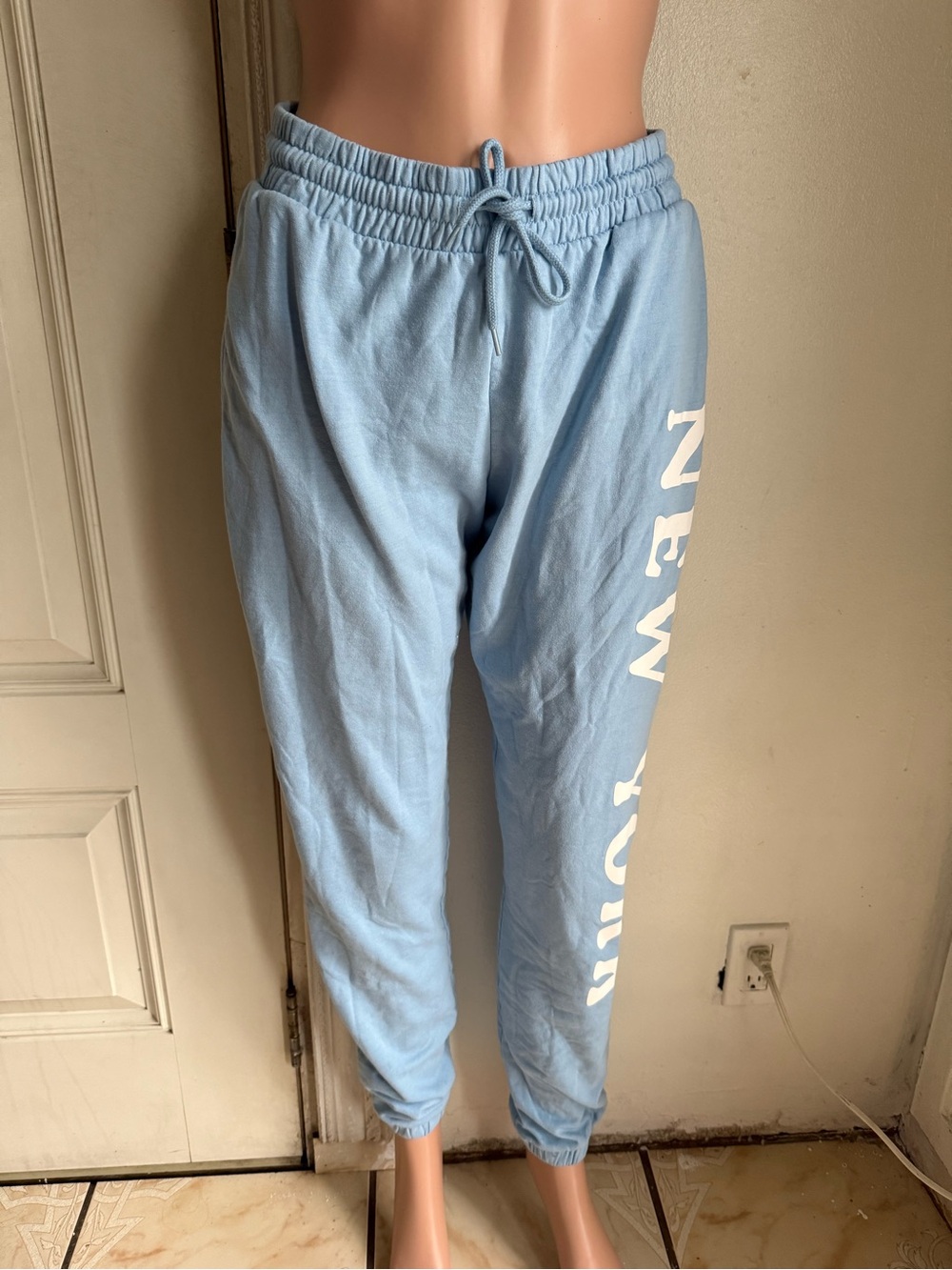 Woman’s Rebellious One Light Blue Fleece Joggers with White Script Logo size S